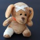 stuffed animal with bandage on head